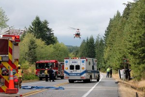 A helicopter takes off to transport patients to a hospital following a roll over collision on Highway 525 Wednesday. Nobody suffered life-threatening injuries.