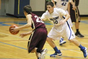 Josh Bishop cuts off the lane from Cougar freshman Hunter Fritz on Monday night.