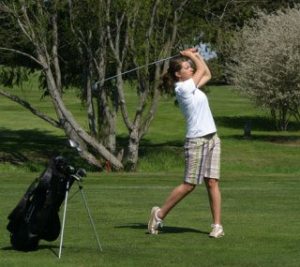 Falcon golfer Olivia Hamilton swings toward the green on the first hole Wednesday at Useless Bay Golf Club.