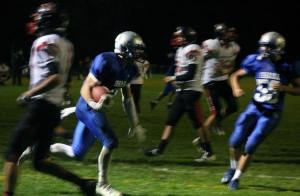 Falcon senior Nick Bennett sprints through the end zone to his teammates after catching a go-ahead two-point pass with seven seconds remaining against Archbishop Murphy on Friday