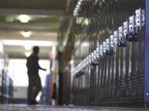 A staff member at Langley Middle School walks to the school’s office during class time Friday.