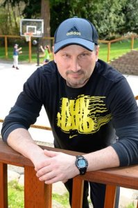 Erik Jokinen poses for a photo while his children