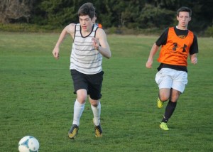 Jeffrey Meier chases after the ball during a South Whidbey boys soccer practice.