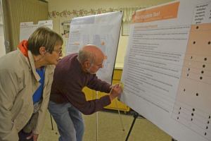 Jim Sundberg writes down a suggestion on a display with his wife