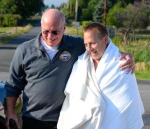 South Whidbey Fire/EMS Deputy Chief Mike Cotton greets Chuck Maddox after his rescue from the chilly waters of Holmes Harbor on Monday.