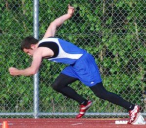 Falcon Jon Poolman takes off in the 200-meter dash Friday during the Cascade Conference track-and-field championships at Cedarcrest High School.