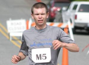 Kurt Warwick reaches the finish of the 2011 Langley Half Marathon. The 22-year-old claimed second place in 1:22:3.6 on the 13.1-mile loop from Langley to Saratoga.