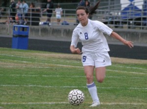 Paige Farmer dribbles toward Sultan's goal in the first half of the match Thursday night. Farmer