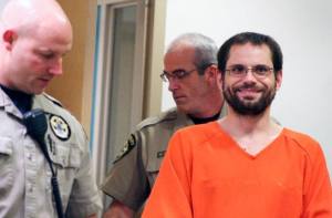 Sean Paul DeMerchant enters a courtroom in Island County Superior Court Monday to face arraignment on two charges of first-degree assault.