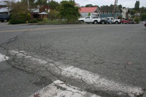 Part of the road is cracked and sunken along Second Street in Langley. The base of the road is failing