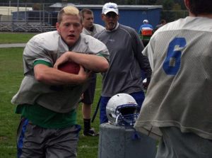 Cooper Nichols takes a handoff during drills Monday after rushing 15 times in a 21-20 win against Cedar Park Christian High School on Sept. 13.