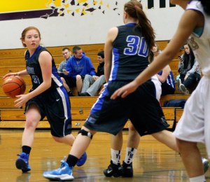 Madi Boyd gets a screen from freshman Emily Turpin against Friday Harbor on Saturday. The Wolverines tore apart the Falcons’ defense in the 55-21 victory that kept South Whidbey winless.