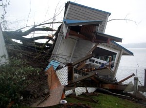 The summer home owned by Morgan and Laurie Bartlett is considered a total loss as the landslide pushed it off its foundation