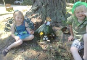Amelie and Finn Tyler sit under a tree at Meerkerk Gardens’ annual Fairy House building festival. Below