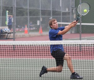 Falcon senior Jonathan Peterson lunges for a backhand volley against University Prep on Tuesday.