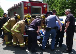 Emergency responders from North Whidbey Fire and Rescue and Washington State Patrol pull a Freeland man from a minivan that drifted off Highway 20 and crashed in nearby woods.