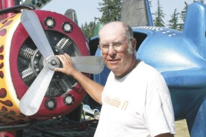Paradise Amusements employee Larry Fosgate prepares to set up the Dive Bomber midway ride at the Island County Fair in Langley: “I like working with the little tykes.”