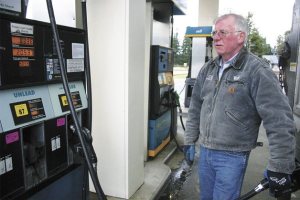 Bill Tulloch watches the meter tick toward $100 as he fills the Good Cheer delivery truck on Tuesday.