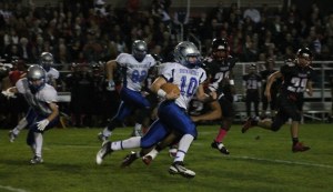 Falcon senior running back Deven Damerau snaps off a long run against Archbishop Murphy in the first half Oct. 3.