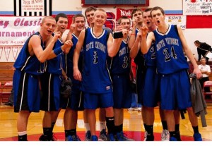 It was all smiles and cheers for the South Whidbey boys basketball team after it won the Seaside Holiday Classic in Seaside