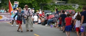 Betty and Jim Lightner march in the Maxwelton Independence Day Parade followed by members of the Whidbey PFLAG chapter on July 4.