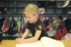 Claire Philp puts the page numbers on a book she is writing