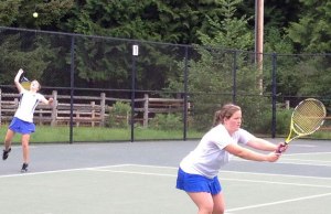 Tess Radisch tosses for serve during the 1A tri-district girls tennis tournament. South Whidbey's top doubles team of Radisch and Amelia Weeks qualified for the state 1A tournament this week.