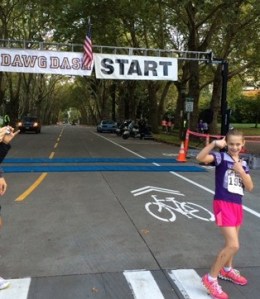 Kaia Swegler Richmond poses by the finish line of the Dawg Dash 5K on Oct. 19 in Seattle.
