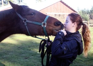 Taryn McKay gives a kiss to Thunder