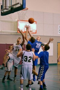 Blaine LeRoy (22) fights for a loose ball during a Junior Falcon basketball game against Arlington on Feb. 28. The South Whidbey seventh/eighth-grade boys team finished with a league-best 6-2 record in regular season games and had a bye in the first round of the Skagit Tulip Tournament on March 7.