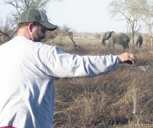 David Reeves sprinkles the ashes of former South Whidbey teacher and track coach Carl Westling at Pendjari Game Park in the African country of Benin