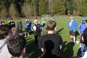 Falcon boys soccer head coach Emerson “Skip” Robbins speaks to players during the first day of tryouts March 2.