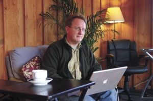 Russell Sparkman tries out the ambience at Langley Center Coworks: “I call it a home office away from home.”