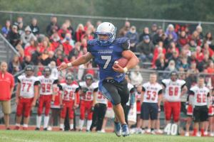 South Whidbey senior running back Kohl Hunter rushes the ball against Coupeville on Sept. 4 at Waterman’s Field. The Falcons beat the Wolves
