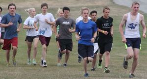 South Whidbey’s cross country teams head out for a run at Camp Casey in Coupeville at the start of the season. Leading the pack are Gavin Imes