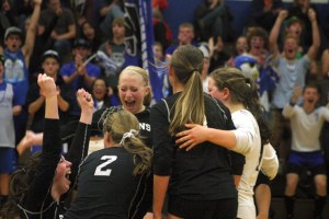 Hannah Calderwood falls to her knees and screams in elation after scoring the winning kill to defeat Archbishop Murphy 3-1 on Thursday. The Falcon senior scored 10 kills and four blocks on Senior Night.