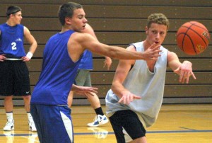 Falcon senior Sam Turpin passes through the defense of junior Kale Reichersamer.