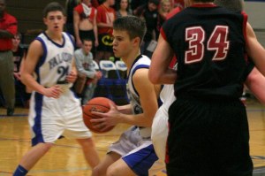 Falcon senior Taylor Simmons uses a screen to probe the paint.