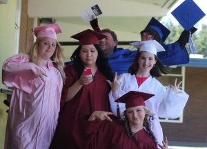 The South Whidbey Academy graduates let off a little anxiety before the ceremony begins June 5. From left are Erika Campbell