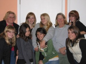 Knight Riders 4-H club members pause from their pie baking for the Mobile Turkey Unit. From left to right first row: Shelby Sterbenz