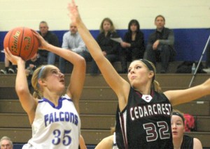 Hayley Newman avoids this block against Cedarcrest’s Courtney McKinney in a game earlier this season. Newman has been on a roll lately