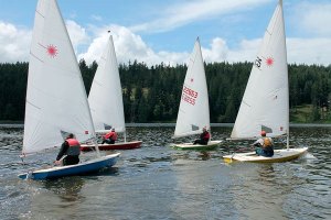 The frontrunners turn in a race to the finish line in the Lasers/Vanguard 15 class.