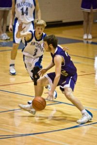 Falcon Riley Newman defends against a Tenino player during the last game before winter break. Newman leads all Cascade Conference scorers with 89 points after five games. His team is poised for a great year