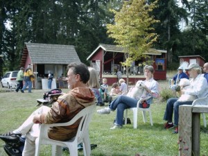 Visitors relax on a sunny Saturday at Tilth Farmers Market.
