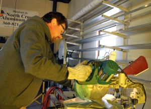 Mark Moore cuts aluminum for stairs to be installed in a multi-unit building in Seattle. The North Cross Aluminum employee will have lots of cutting and fabricating ahead of him with the recent award of the fire boat bid with South Whidbey Fire/EMS.