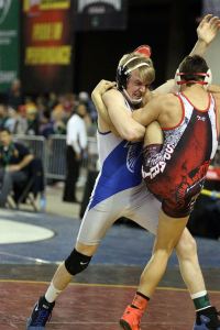 South Whidbey junior Hunter Newman takes down Granger’s Frankie Almaguer in the 138-pound bracket of the WIAA Mat Classic State Championships.
