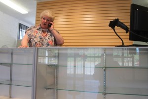 Maureen Cooke takes a call from a cable news reporter about her recreational marijuana sales license