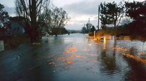 Shore Avenue in Useless Bay sits covered in water early Thursday. A spring storm