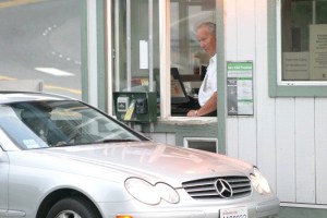 Clinton Ferry Terminal worker Stan chats with a commuter at the toll booth.