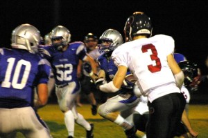 Sam Lee looks for blockers Avery Buechner (10) and Mason Shoudy (52) during a 50-yard catch and run during the first quarter against King's on Friday.
